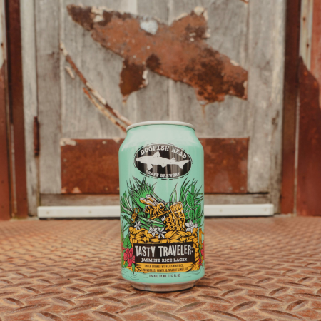 Can of Tasty Traveler Lager with an illustration of bee surrounded by grass holding a honey comb