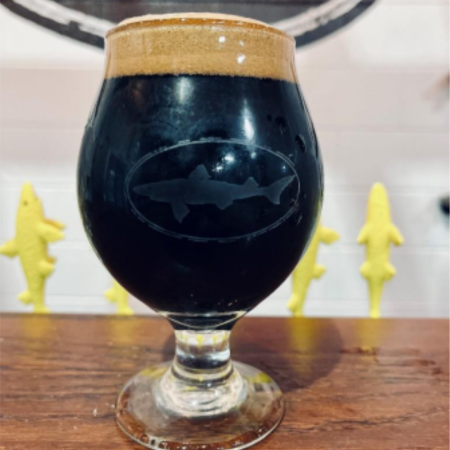 Dogfish Head beer Calvados Barrel Aged World Wide Stout in a tulip glass